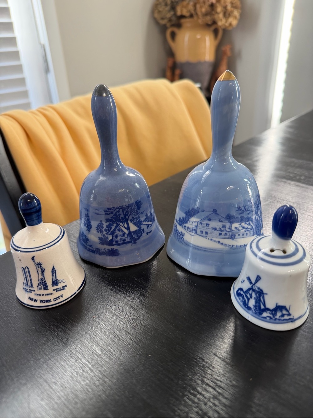 Four vintage blue and white bells